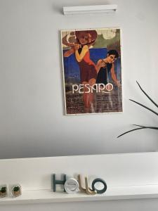 a poster for a movie hanging on a wall at Soria Home-A due passi da Centro e Mare in Pesaro