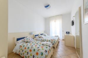 Postel nebo postele na pokoji v ubytování B&B Anna Lungomare