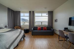 Voodi või voodid majutusasutuse Volcano Hotel toas