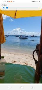 a view of a beach with boats in the water at Casa Azul Gamboa do Morro in Gamboa