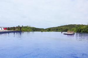 a large body of water with two boats in it at Villas Pitanga 2 in Maceió