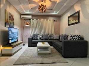 O zonă de relaxare la Élégant Appartement à Centre-ville Kenitra