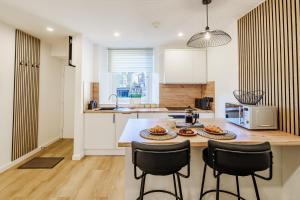 a kitchen with a table with food on it at Luxurious One Bedroom Apartment in Perth