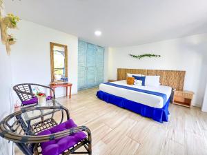 Postel nebo postele na pokoji v ubytování Hotel Isla Palma Reserva Natural