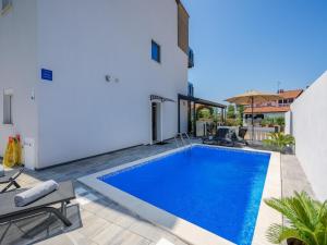 a swimming pool in the backyard of a house at Apartment in Kukci with Heated Pool in Kukci
