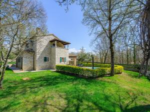 a stone house in the middle of a yard at Villa in Banki with Private Pool near Marea Beach in Rajki