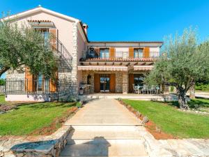 a house with a walkway in front of it at Villa in Sveti Lovrec near Ski Resort in Radetići