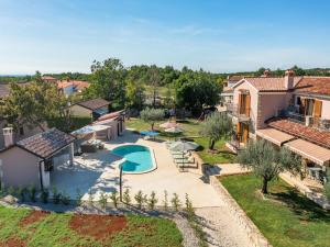 an aerial view of a house with a swimming pool at Villa in Sveti Lovrec near Ski Resort in Radetići