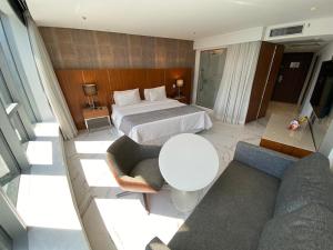 a hotel room with a bed and a couch at Hotel Nacional Rio de Janeiro in Rio de Janeiro