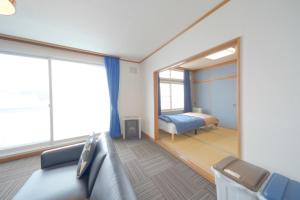 Foto sihtkohas Kutchan asuva majutusasutuse 倶知安Tsuru House 車ガレージ完備 スーパーマーケット徒歩2分 galeriist