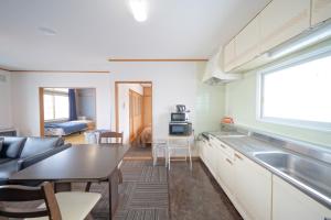 Foto sihtkohas Kutchan asuva majutusasutuse 倶知安Tsuru House 車ガレージ完備 スーパーマーケット徒歩2分 galeriist