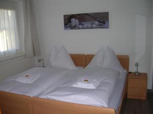 Postel nebo postele na pokoji v ubytování Appartements Mantinger