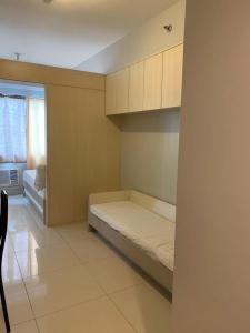 Postel nebo postele na pokoji v ubytování Wind and Sea at Sea Residences + 102 fotografií