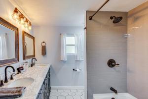 a bathroom with two sinks and a shower at Waterfront Retreat with Hot Tub in Gun Barrel City! in Gun Barrel City +22 photos