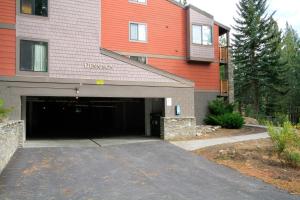 a building with a garage with a red building at Summit 285 1 bedroom 1 bathroom - Pet Friendly in Mammoth Lakes