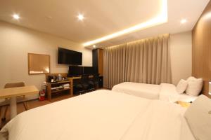 Hotel Prima Busan客房内的一张或多张床位