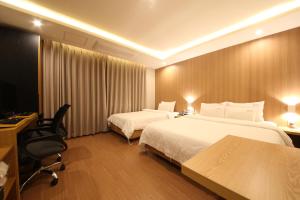 Hotel Prima Busan客房内的一张或多张床位