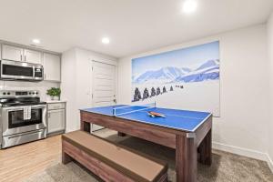a room with a ping pong table in a kitchen at Hot Tub, Heber Home, Pet-Friendly, Games, Sleeps 13 Guest! in Heber City +55 photos