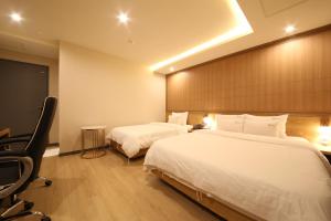 Hotel Prima Busan客房内的一张或多张床位
