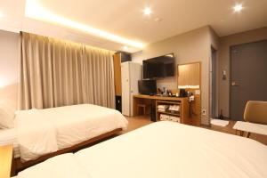 Hotel Prima Busan客房内的一张或多张床位
