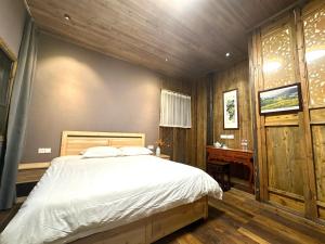 Postel nebo postele na pokoji v ubytování Wuyuan Koshin Homestay