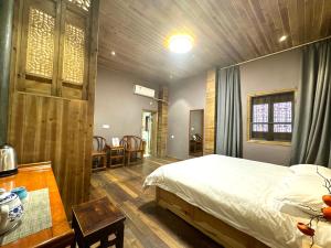 Postel nebo postele na pokoji v ubytování Wuyuan Koshin Homestay