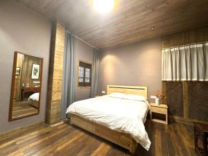 Postel nebo postele na pokoji v ubytování Wuyuan Koshin Homestay