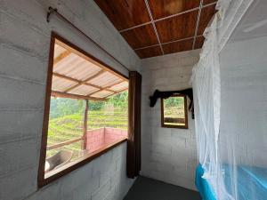 a small room with a window in a house at Kingdom of Rustic Ella in Ella