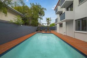 a swimming pool in the backyard of a house at Asraport Motel in Brisbane