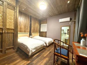 Postel nebo postele na pokoji v ubytování Wuyuan Koshin Homestay