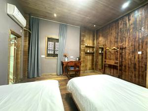 Postel nebo postele na pokoji v ubytování Wuyuan Koshin Homestay