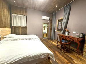 Postel nebo postele na pokoji v ubytování Wuyuan Koshin Homestay