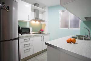A kitchen or kitchenette at Granada Home Centro