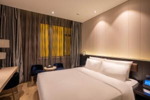 Katil atau katil-katil dalam bilik di Crystal Hotel Shanghai Lujiazui Oriental Pearl Tower