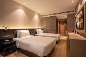 Katil atau katil-katil dalam bilik di Crystal Hotel Shanghai Lujiazui Oriental Pearl Tower