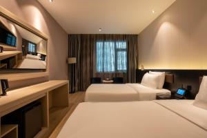Katil atau katil-katil dalam bilik di Crystal Hotel Shanghai Lujiazui Oriental Pearl Tower