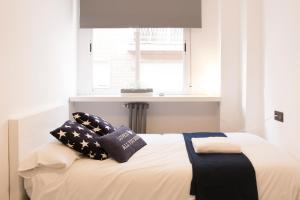 A bed or beds in a room at Granada Home Centro