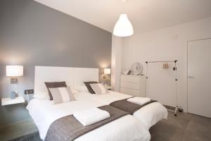 A bed or beds in a room at Granada Home Centro