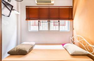 Ένα ή περισσότερα κρεβάτια σε δωμάτιο στο 1137 Hostel