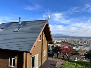 a house with solar panels on the roof at July In Furano in Nakafurano +38 photos