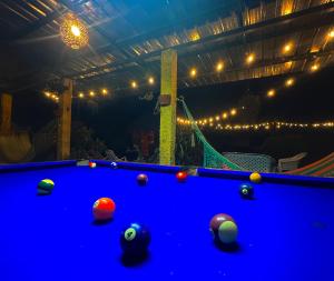 a pool table with balls on top of it at Green Hostel in Moyogalpa