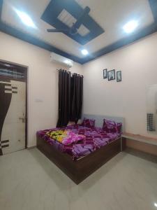 a bedroom with a large bed in a room at Shiv Shakti Palace in Rīngas