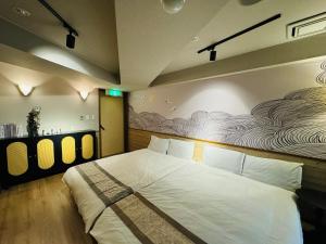 Een bed of bedden in een kamer bij Sengokuhara Onsen Hotel