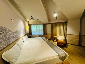 Een bed of bedden in een kamer bij Sengokuhara Onsen Hotel