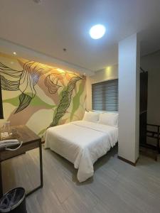Postel nebo postele na pokoji v ubytování Maharlika City Inn