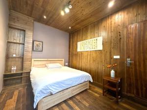 Postel nebo postele na pokoji v ubytování Wuyuan Koshin Homestay