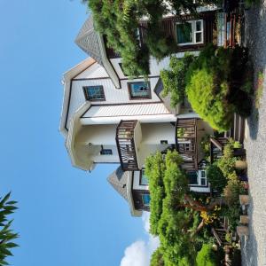 an overhead view of a building with trees at Anmyeondo Bada Sarang Naksi Pension in Taean