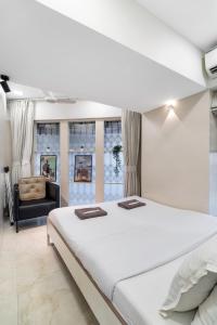 Una cama o camas en una habitación de Dido 1BHK Bandra W by The Bombay Home Company
