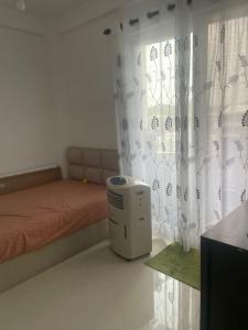 Ένα ή περισσότερα κρεβάτια σε δωμάτιο στο Nisala housing apartments