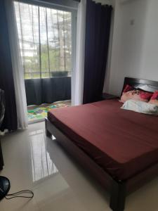 Ένα ή περισσότερα κρεβάτια σε δωμάτιο στο Nisala housing apartments